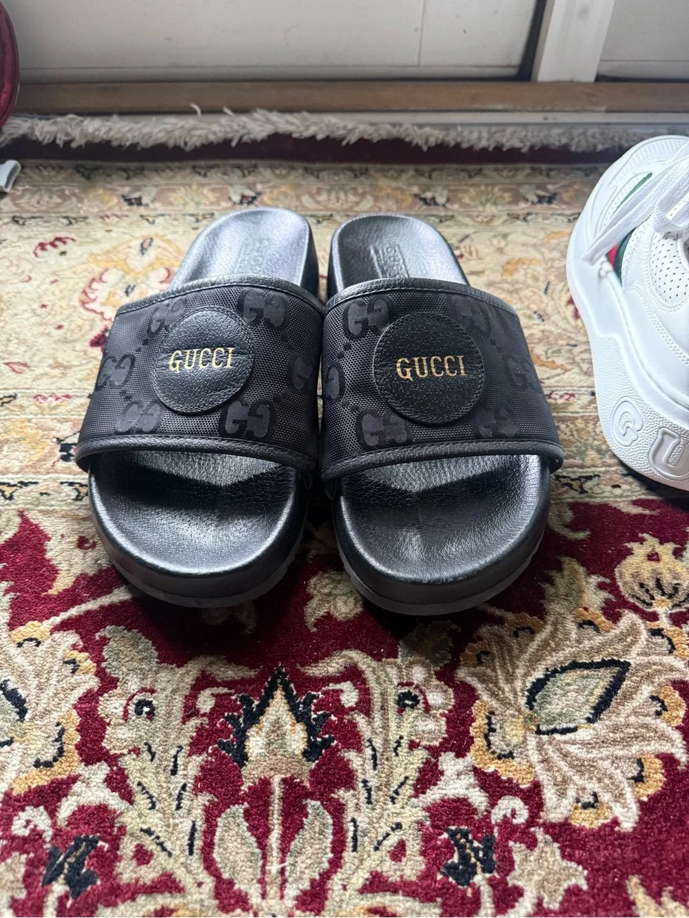 Gucci Black GG Monogram Slide Sandals with Gold Logo